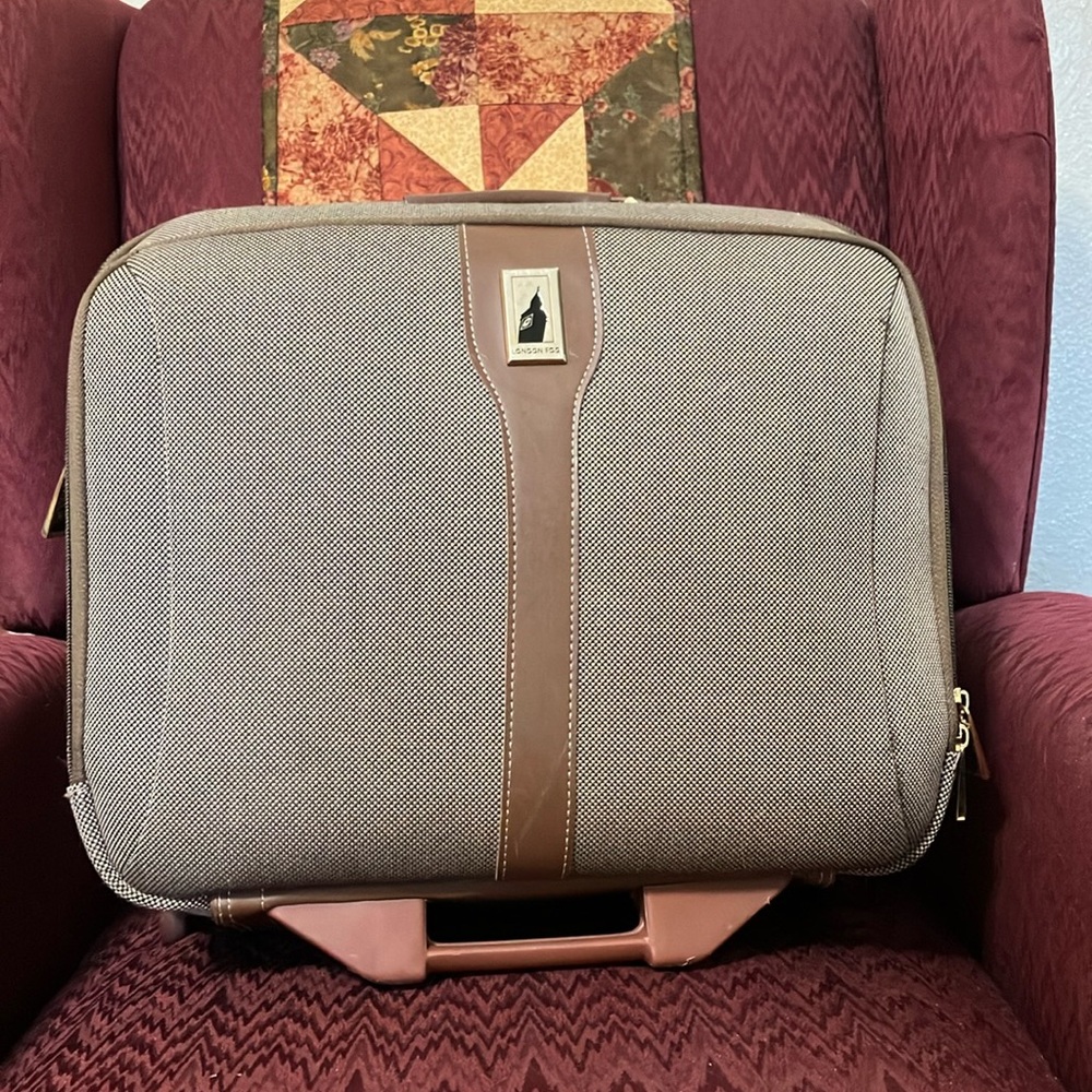 London Fog rolling carry on.